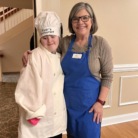 DSADE staff member Nancy and cooking student River